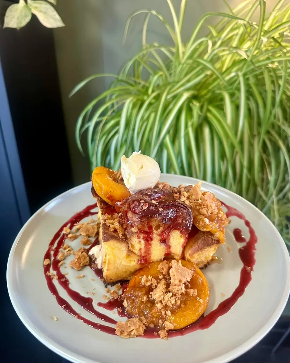 Brioche Feuilletée French Toast special with spiced stone fruit at The Good Earth Cafe