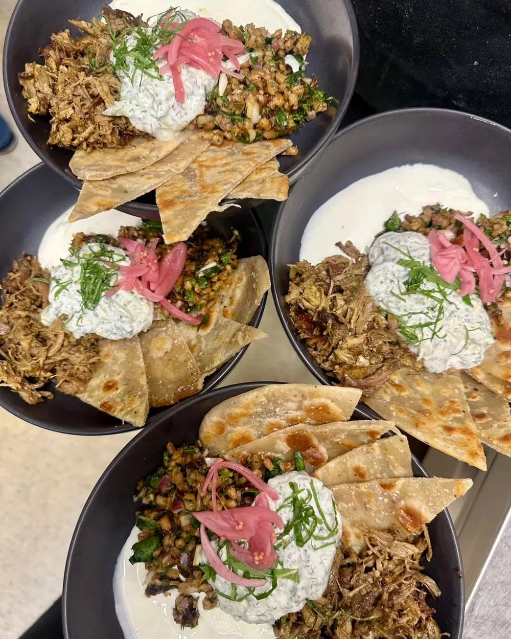 Kitchen specials including lamb flatbread at The Good Earth Cafe
